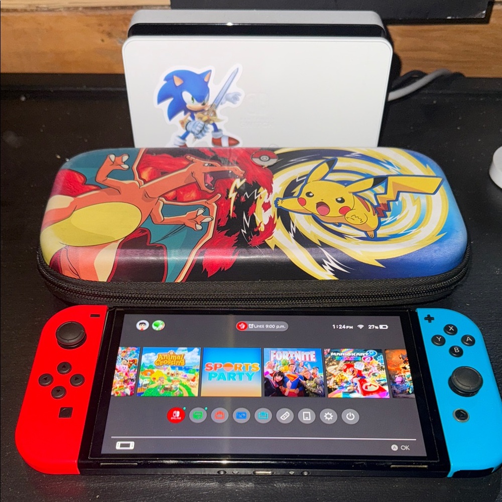 Nintendo Switch with Red and Blue Joy-Cons and Pokémon Case